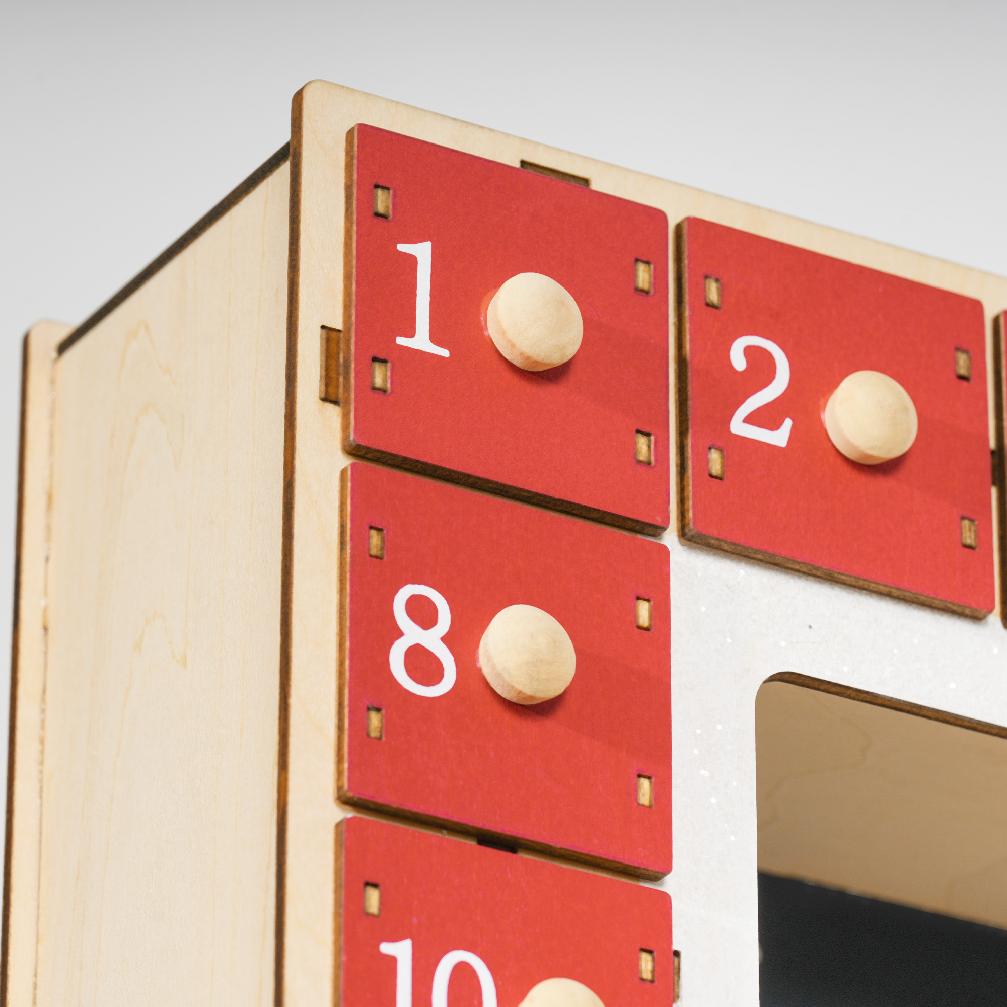 LED Adventskalender mit Dorfszene, 24 große Schubladen, MDF, 34 x 7 x 34 cm, Rot